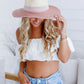 woman wearing a colored brim  and band summer straw hat - blush pink