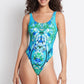 woman wearing a blue and green floral one piece bikini