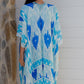 woman wearing a blue ikat print kimono