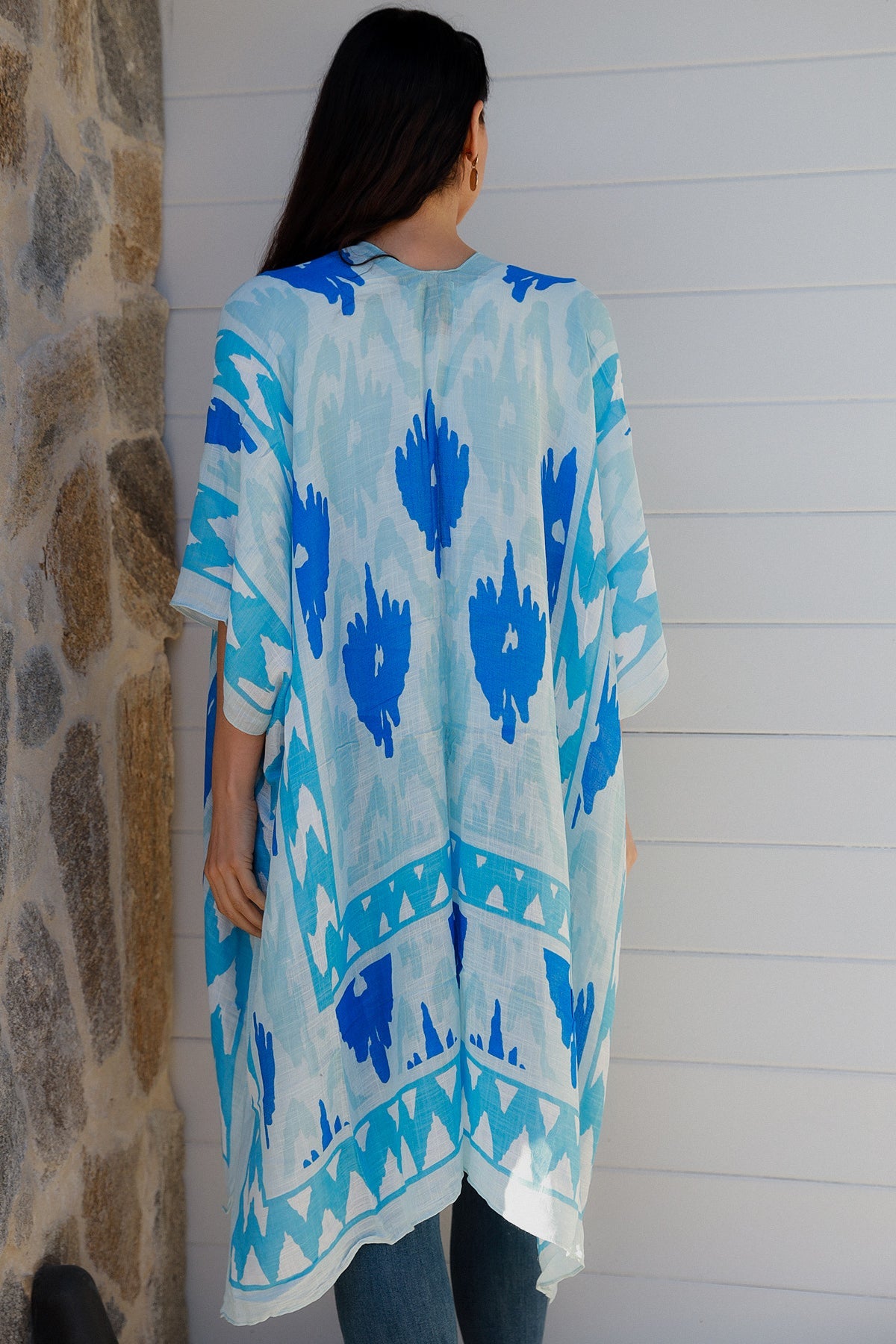 woman wearing a blue ikat print kimono