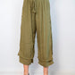 3/4 length loose capri trousers with tie on waist in olive green color with three buttons on the side