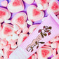 Bopo Women berry blush lip balm with heart sugary gummies on the background