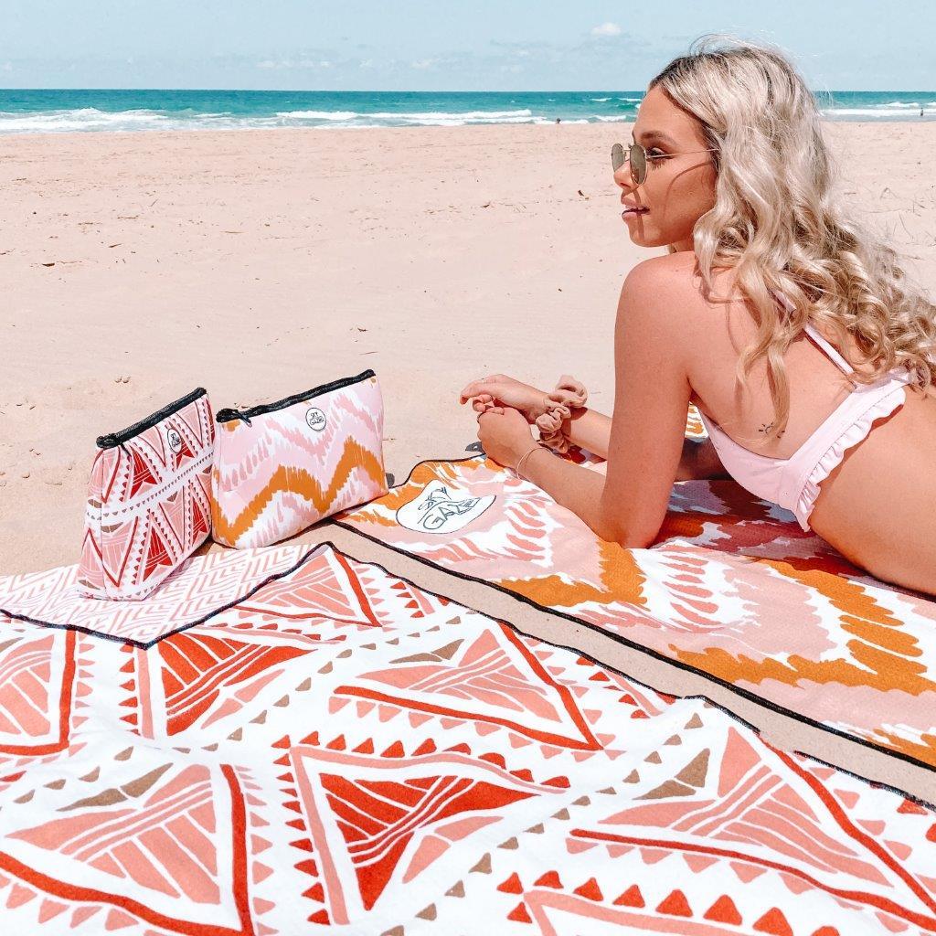 woman at the beach with Sand Free Towel - The Lennox Rust Bohemian Triangle