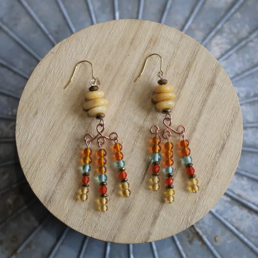 Althea Citrine Chandelier Hook Earrings on a small wooden display platform