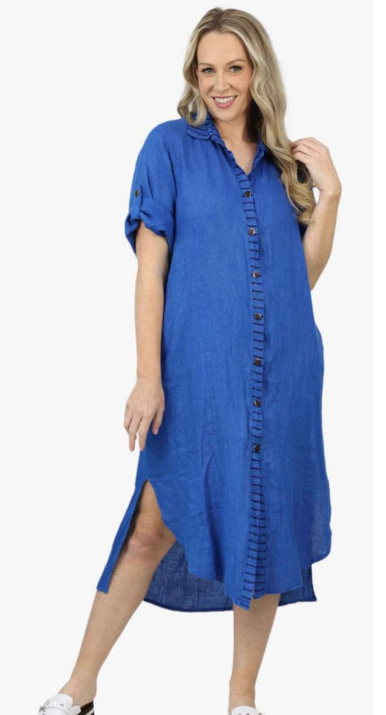 woman wearing  a blue orion linen shirt dress 