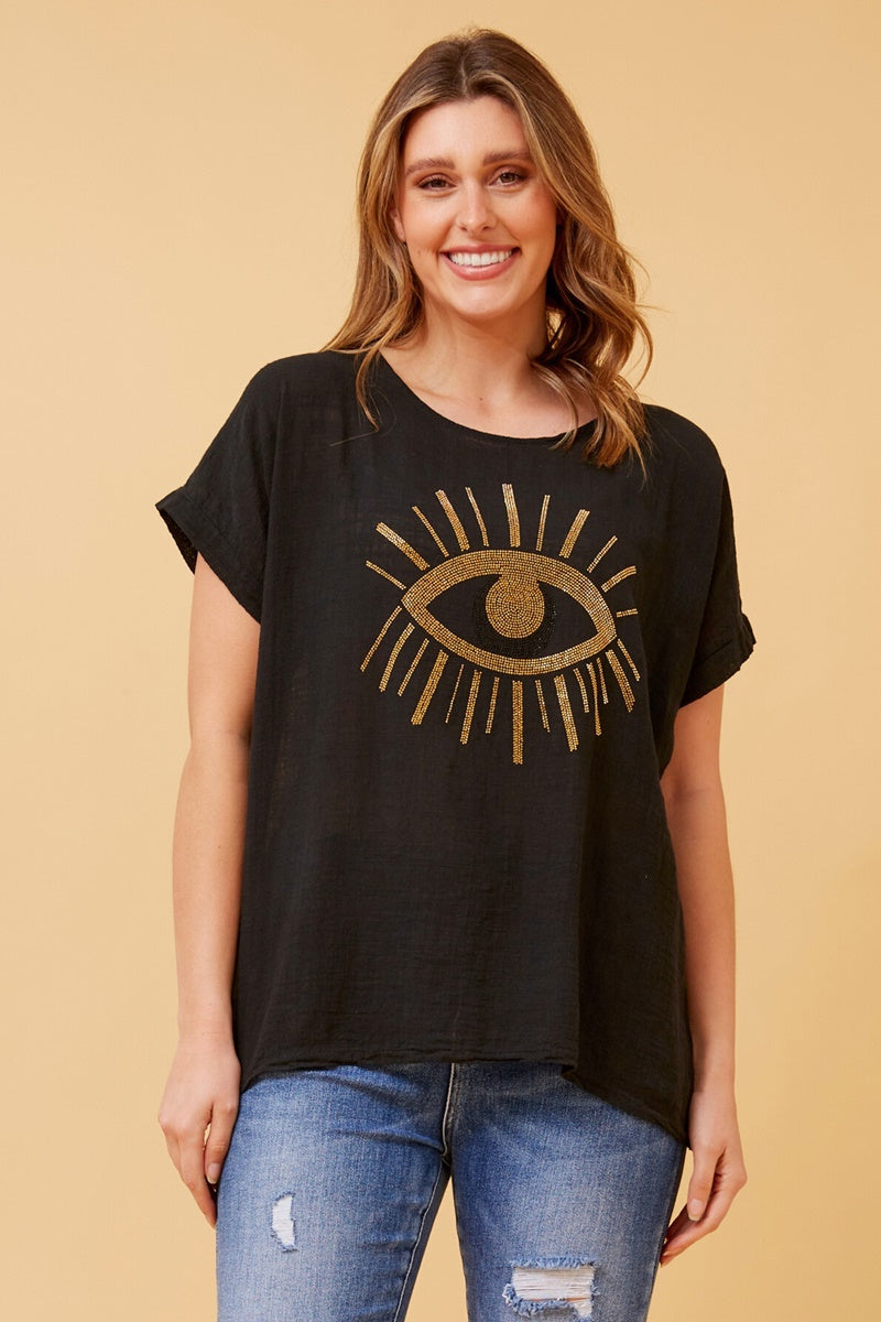 woman wearing a glitter gold sequin evil eye top - black