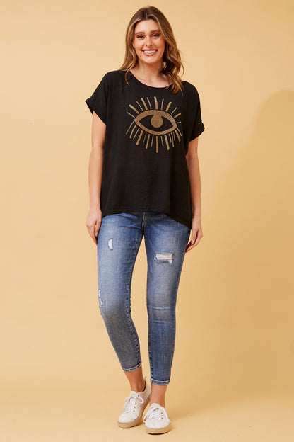 woman wearing a glitter gold sequin evil eye top - black