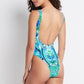 woman wearing a  green and blue floral backless one piece bikini 