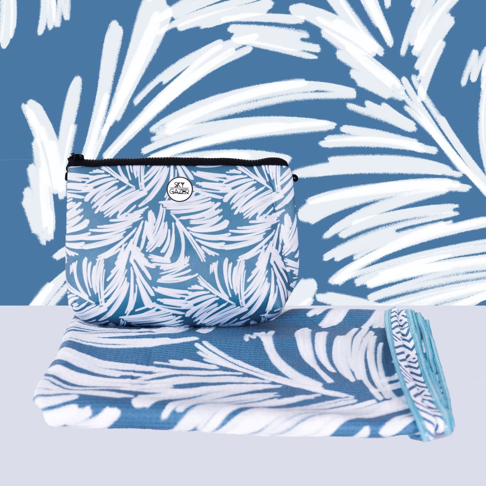 burbuja leaves printed on a cornflower blue sand free towel. sky gazer - the ned