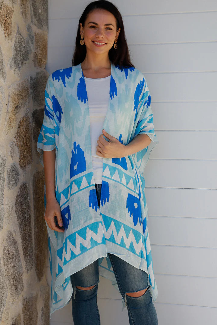 woman wearing a blue Ikat print kimono