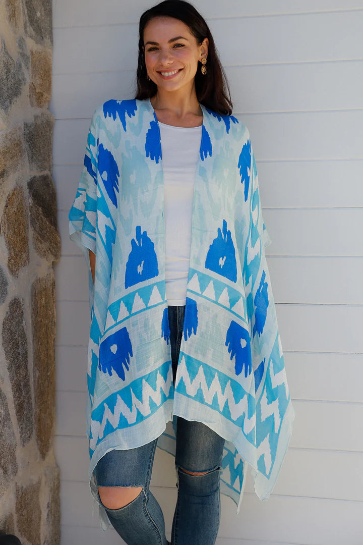 woman wearing a blue ikat print kimono