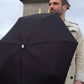 Man sporting a Anatole Jane Collapsible Micro Umbrella
