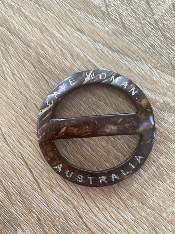 cave woman belt buckle