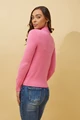 woman wearing a pink Petunia Turtleneck Long-Sleeve Knit Top