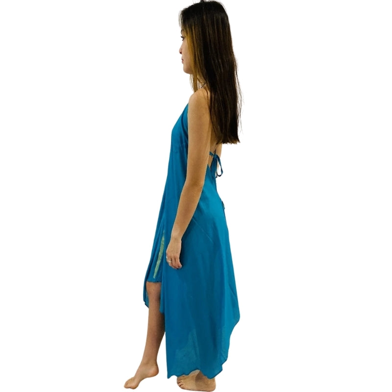 woman wearing halterneck beach dress in blue color with green lining