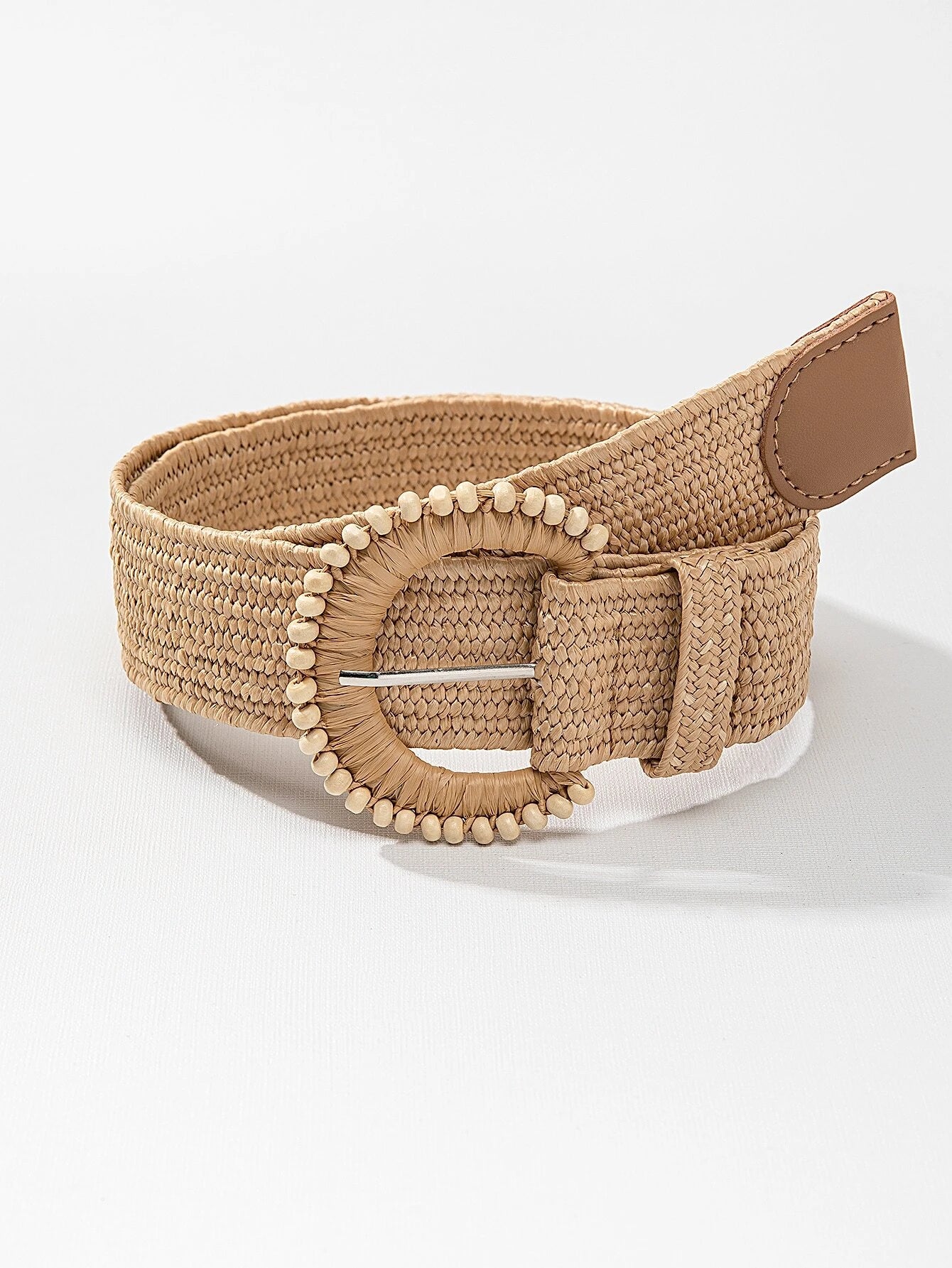 woven straw belt with leather on the end and beads on the edge of the buckle