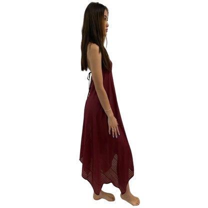 woman wearing halterneck beach dress in maroon color sideview