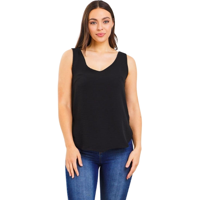 woman wearing a v-neck shell sleeveless top in black