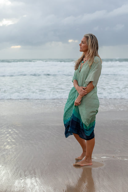 woman on the beach wearing Amera Eid Kaftan - Bahr Design