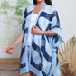 woman wearing a blue swirl kimono cover up