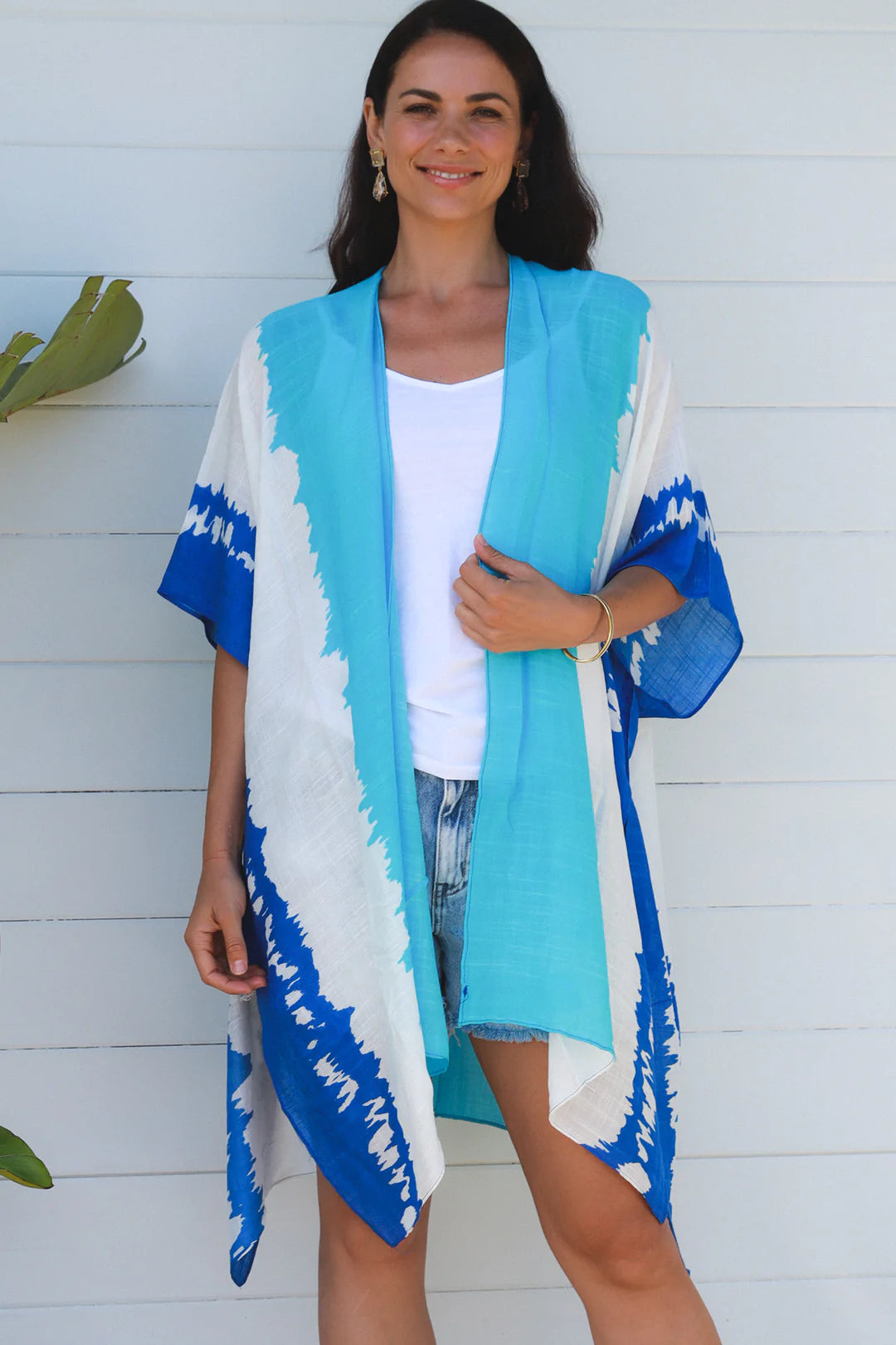 woman wearing a koukla vertical tie dye kimono in two tone blue