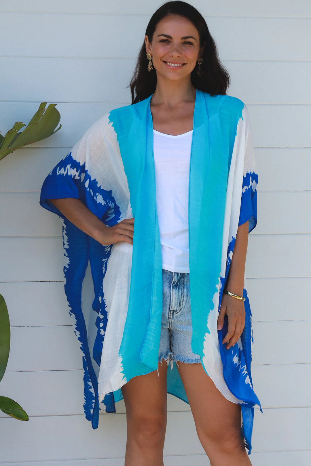 woman wearing a koukla vertical tie dye kimono in two tone blue