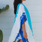 woman wearing a koukla vertical tie dye kimono in two tone blue