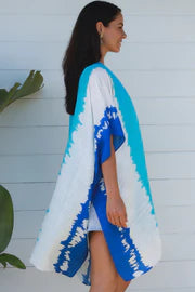 woman wearing a koukla vertical tie dye kimono in two tone blue