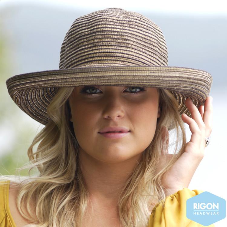 woman wearing a light brown woven sun hat 