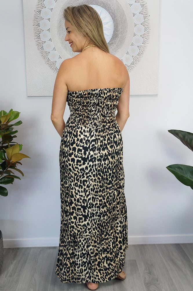 woman wearing a smocked strapless leopard dress back view