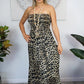 woman wearing a smocked strapless leopard dress 