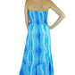 woman wearing blue smocked strapless tube salsa dress back view