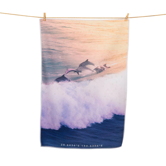 dolphins in the water print tea towel