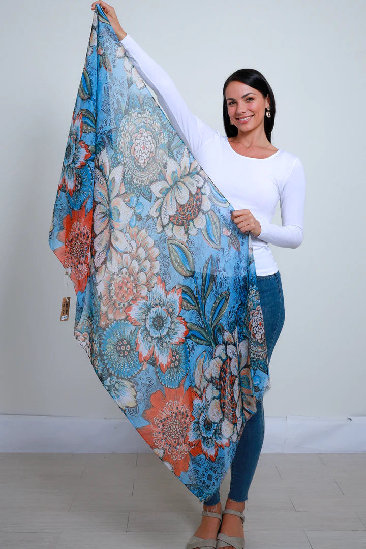 woman showing floral print in blue chiffon scarf