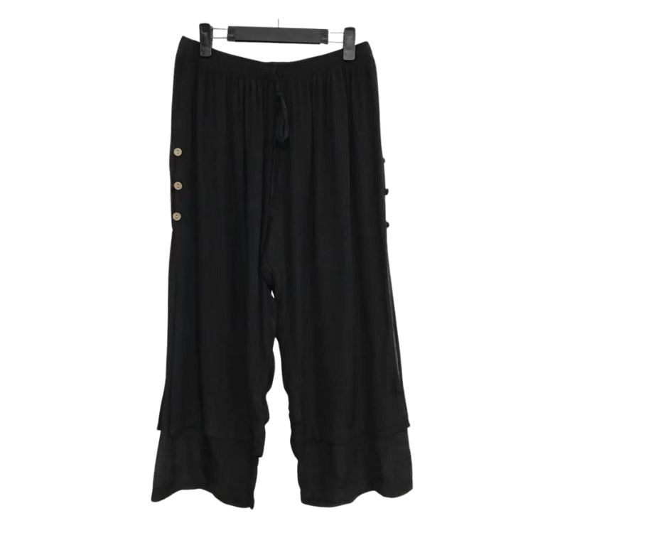 3/4 length loose capri trousers with tie on waist in black color with three buttons on the side