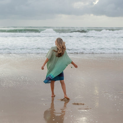 woman on the beach wearing Amera Eid Kaftan - Bahr Design