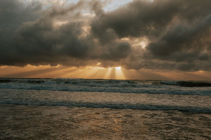 cloudy sunset in caves beach