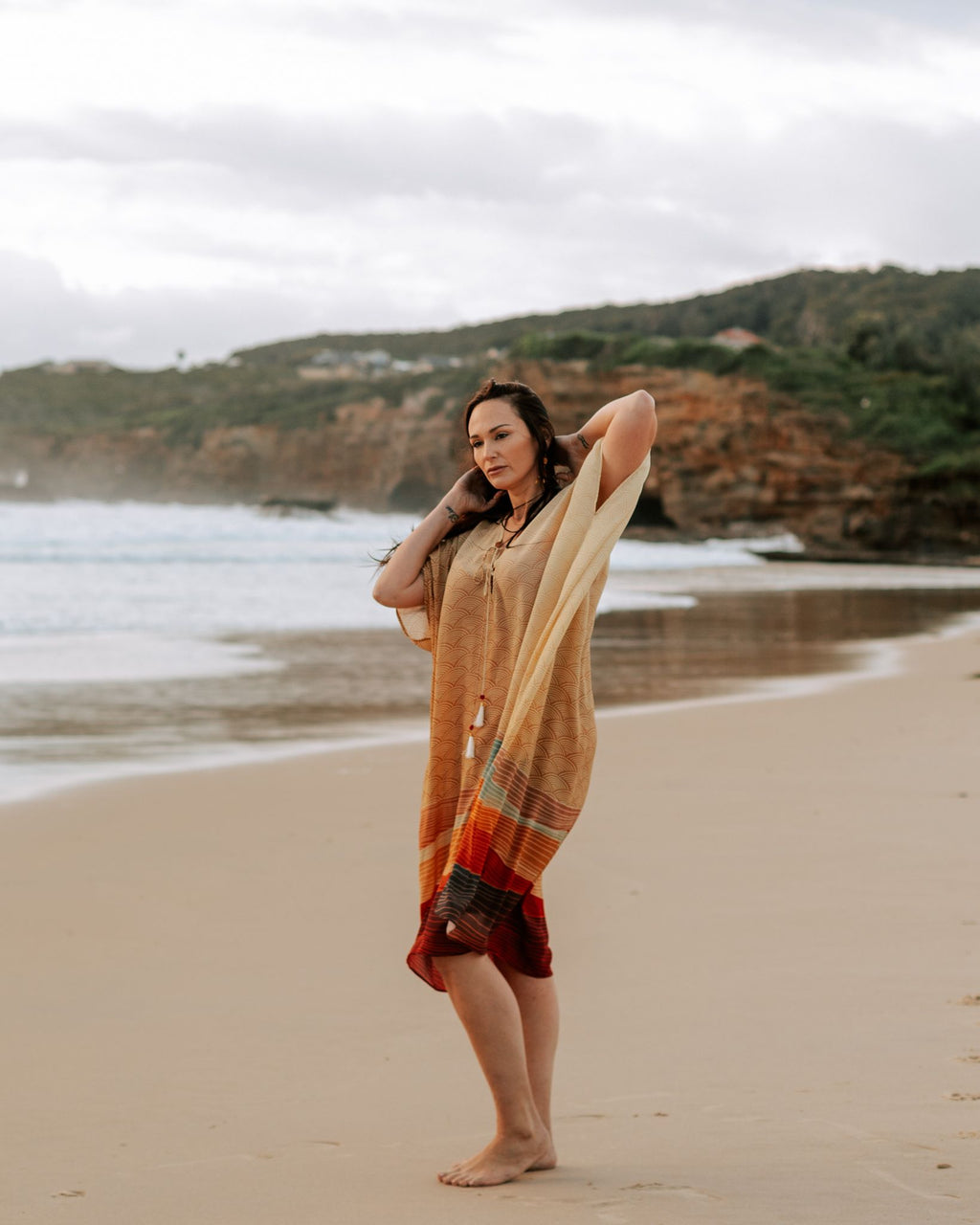 woman on the beach wearing Amera Eid Kaftan - Layali Design