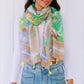 woman wearing summer tropical floral neon green with tassel chiffon scarf
