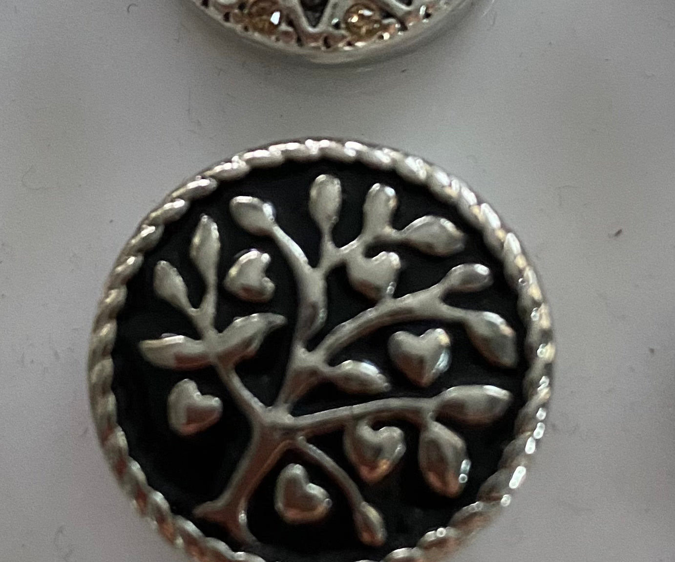 Embossed Tree Design on a black Stone button 7