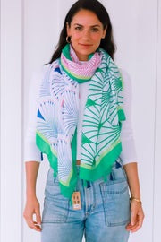 woman wearing a green geometric line fan pattern chiffon scarf