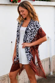 woman wearing jane jungle cape leopard print with brown lining coverup