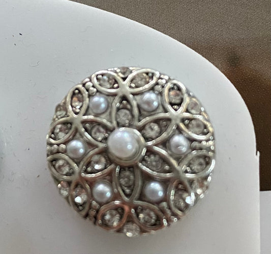 embossed flower adorned with white pearls stone button