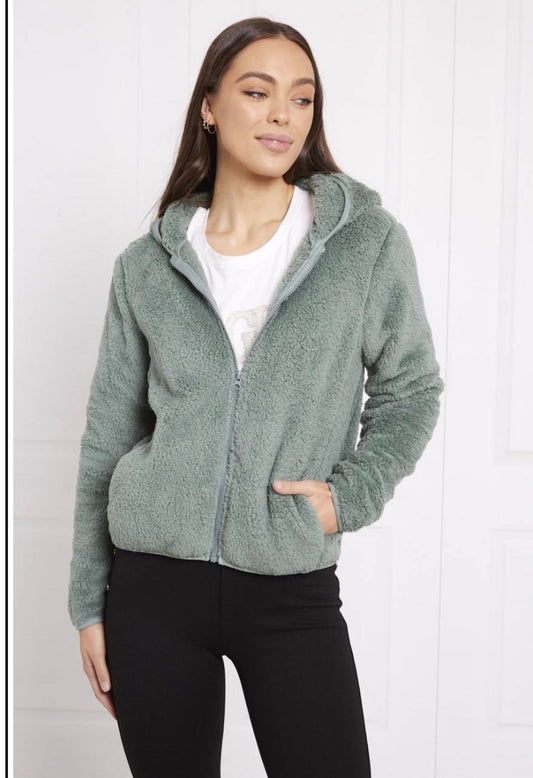 woman wearing a lynney Teddy faux fur plush jacket in sage