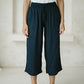 woman wearing a Freez Sicily Shirred Waistband Loose Cropped Trousers with Pockets in ink color
