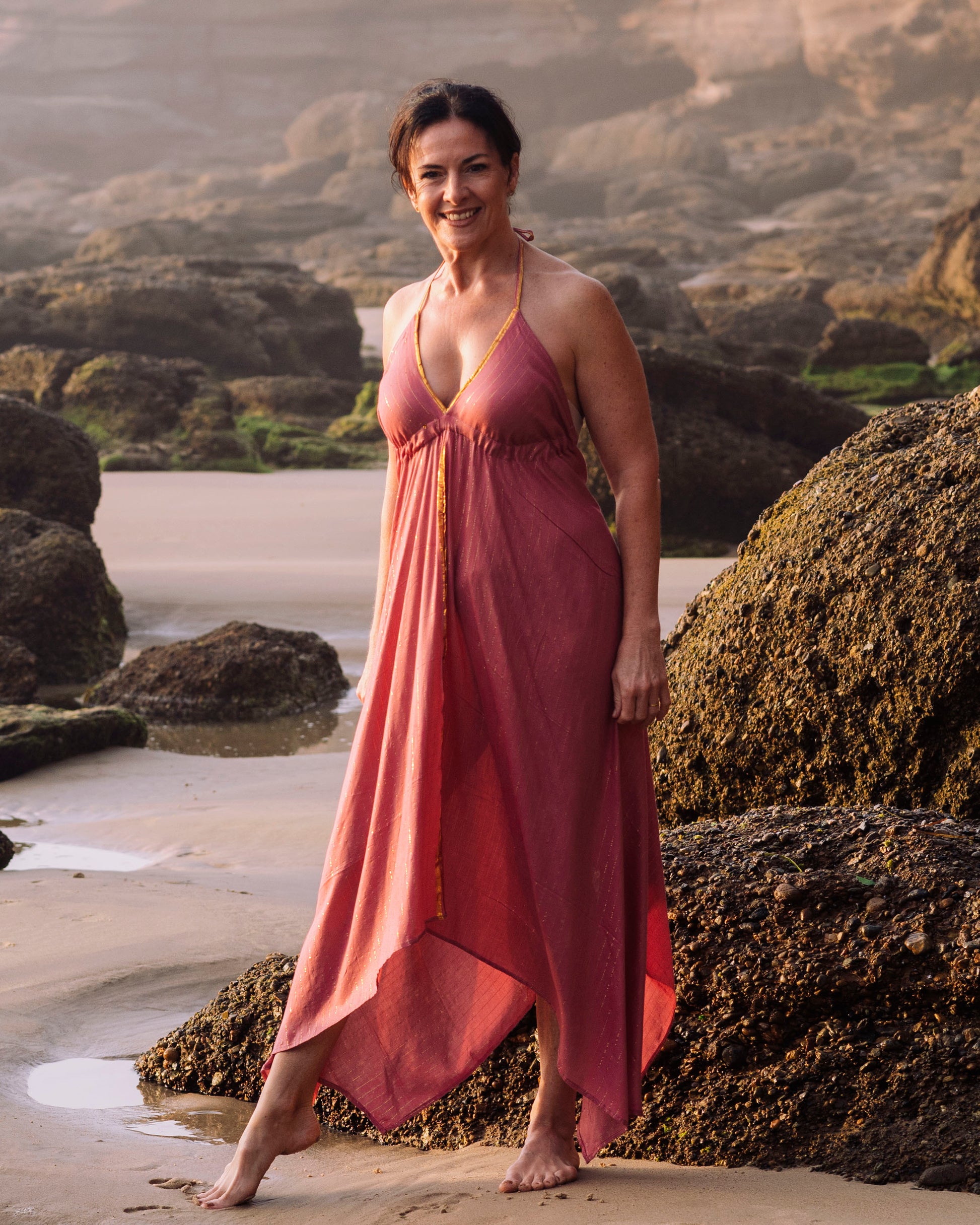 woman on a beach wearing Cave Woman long Indie dress - Shiny threads