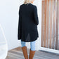 woman wearing black freez slouch cardigan back view