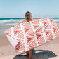 woman at the beach with Sand Free Towel - The Lennox Rust Bohemian Triangle